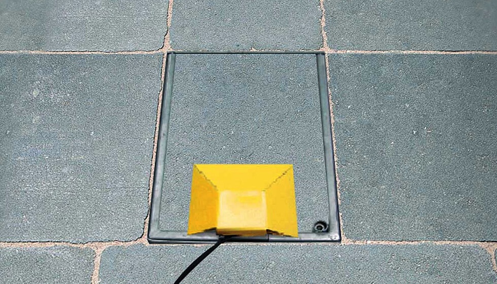 Flip-lid in-ground power units like this accommodate paving and other surface materials in a recessed lid which means they complement their surroundings.